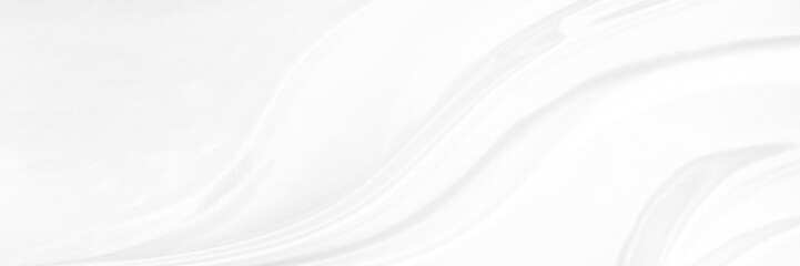 White gray satin texture that is white silver fabric silk panorama background with beautiful soft blur pattern natural.