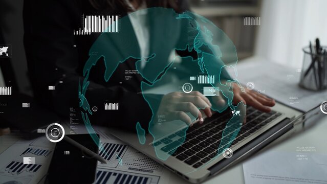A business professional engaged in data analysis using a laptop, featuring a global visualization overlay with analytics charts and financial documents in a modern office setting. Xenic - Powered by Adobe