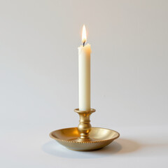 Metallic candle holder features tall, white candle lit with warm flame, creating cozy atmosphere. elegant design enhances any decor, perfect for romantic settings or peaceful evenings