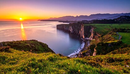 A breathtaking coastal vista at sunrise, with cliffs meeting the sea, golden light reflecting on the water. Lush green meadows frame the scene