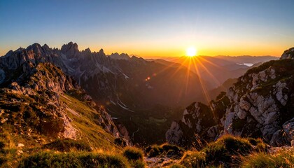 A breathtaking landscape captures a vibrant sunrise over jagged mountain peaks, illuminating a valley with golden hues