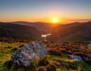 A breathtaking landscape photo captures a warm sunset casting golden rays over rolling hills and a tranquil lake nestled in the valley