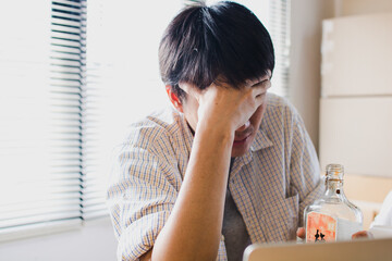A depressed businessman, Disappointed and upset asian man disappointed with achievement results sad in despair inside office was fired from his job