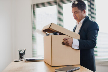 A depressed businessman, Disappointed and upset asian man disappointed with achievement results sad in despair inside office was fired from his job