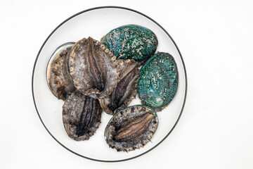 Fresh abalone ingredients on a pure white background