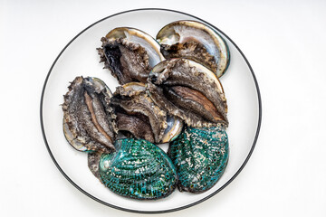 Fresh abalone ingredients on a pure white background
