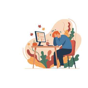 Stressed person at desk with computer symbolizing autumn work burnout and mental fatigue