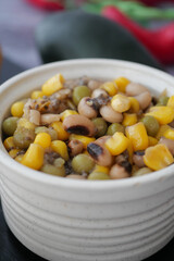 Colorful bean and corn salad in a rustic bowl
