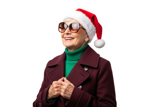 Joyful elderly woman wearing a santa hat and stylish sunglasses isolated on transparent background