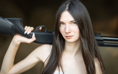 Redhead woman in a suit with a rifle. Special agent.