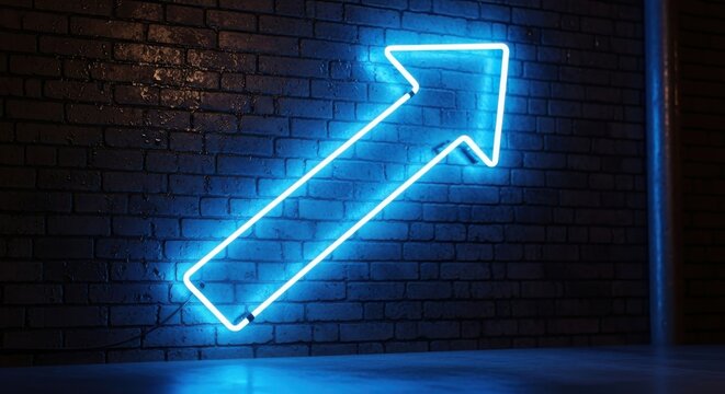 Illuminated arrow sign displays the path to success on brick wall