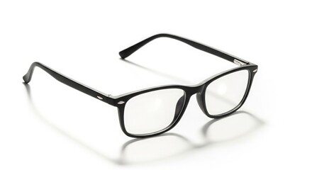 A pair of black-framed eyeglasses resting on a white surface.