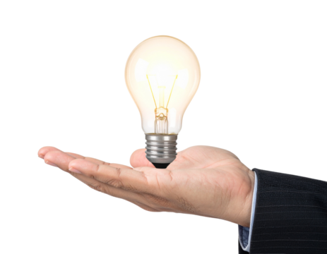 Creative idea, a glowing light bulb, above a businessman's hand, representing inspiration, innovation, and breakthrough in business.