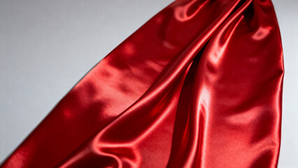 Red satin fabric draped on surface