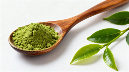 Green tea powder in wooden spoon with leaves