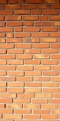 Fototapeta premium Brown, earthy brick surface with subtle color variations, a warm and natural building element, construction, pattern