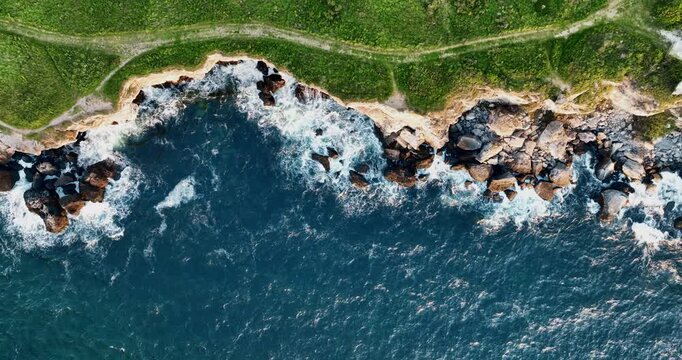Scenic Nature Seascape Landscape Aerial Coastal Sea Scene With Rocky Shoreline, Rocking Blue Ocean Waves on the Shore And Green Hills