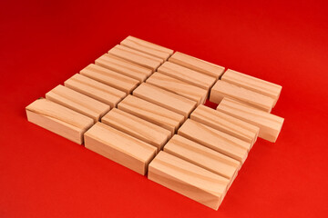 blocks arranged in a grid with one empty spot, illustrating a missing piece and the need to close a critical gap.
