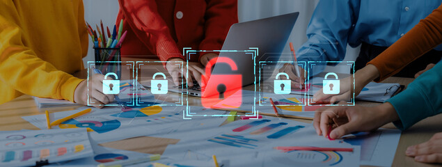 A diverse team collaborates in a bright workspace, immersed in planning a cybersecurity project. The overlay of digital locks symbolizes data protection and secure access. Trope