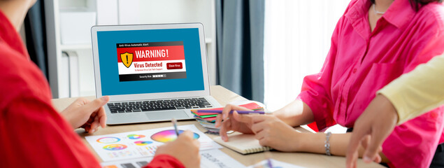 Virus warning alert on computer screen detected brisk cyber threat , hacker, computer virus and malware