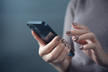 Close up, woman using mobile phone for online shopping and mobile banking, digital payment. Woman using smartphone for social media networking with copy space for online marketing