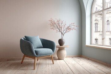 Cozy armchair sits by a window with a vase of branches.