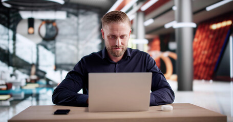Businessman Conducts Webinar In Hotel Lobby, Consulting