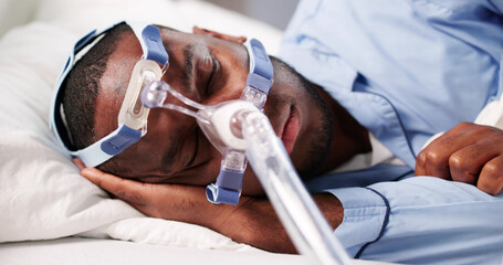 African American Man Using CPAP Mask
