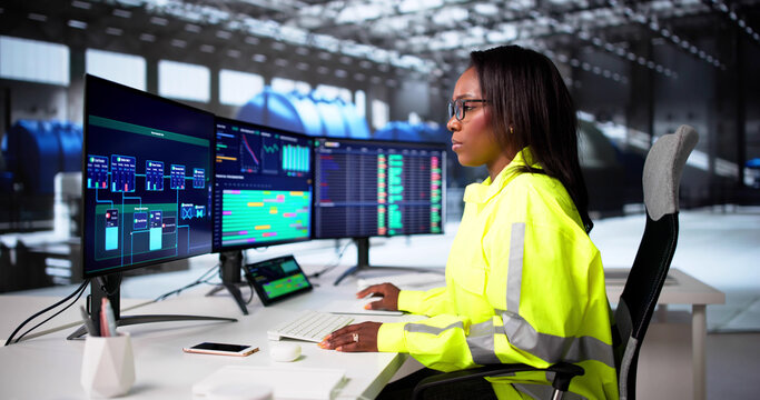 African American Engineer Monitoring Gas Turbine Engine