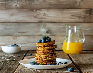 Delicious Stack of Pancakes with Fresh Blueberries and Syrup on a Rustic Wooden Table