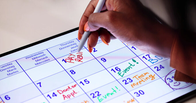 Woman Checking Calendar For Rent Due Date