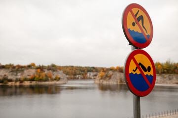 No Swimming Signs by Autumn Lake