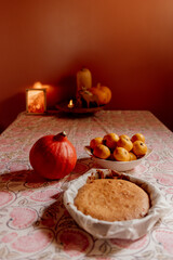 Still live of an homemade cake on patterned tablecloth