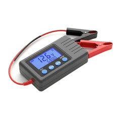 A digital automotive device, with red and black clamps attached, displays a voltage reading on a blue screen, used for testing