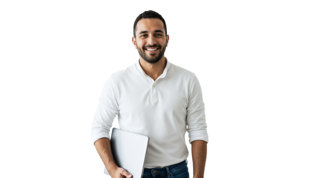 Smiling man holding a laptop in a bright studio setting during the day