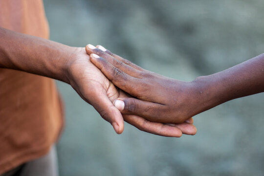Two hands gently touching, symbolizing connection and support