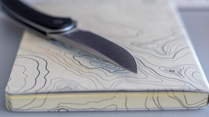 High resolution close up color image of a single traditional EDC pocket knife with a topographical map in the background- Israel