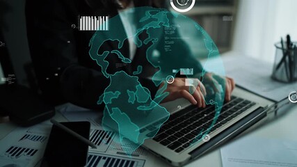 A business professional uses a laptop in a modern workspace, interacting with a digital globe and financial charts to analyze data, showcasing technology and innovation. Xenic - Powered by Adobe