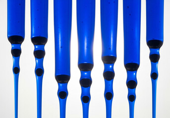 Abstract Blue Hanging Liquid Droplets