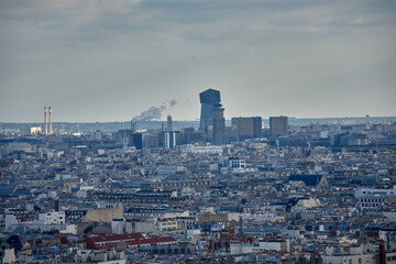 Paris seen from Montmartre hill with traditional architecture and blue sky in a bohemian setting