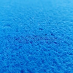 Close up of a blue sponge shows the texture and detail of the material