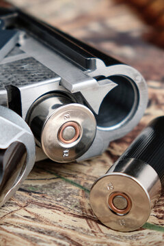 classic 12-gauge double-barreled shotgun with cartridges