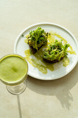 Healthy and delicious morning breakfast. Matcha apple drink and avocado toasts