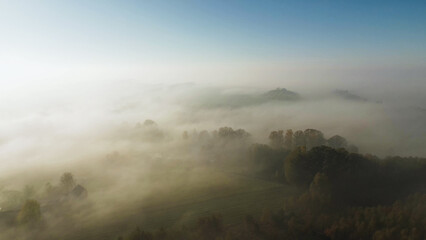 Foggy morning landscape with vibrant autumn colors