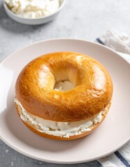 Toasted Bagel with Cream Cheese Spread for Premium Baked Goods Food Object and Breakfast Concept