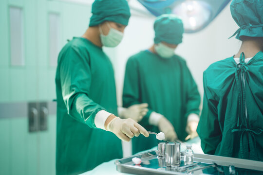 Surgeon doctor rescue patient in surgery operation room hospital emergency save life - Powered by Adobe