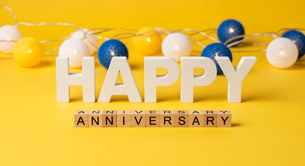 Happy Anniversary Alphabet Sign with LED Cotton Ball Lights on Yellow Background | Celebration Decor Concept
