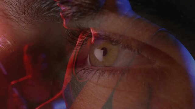 Shifting red blue lights over eye initiating music artist moving toward mic singing with co-singer