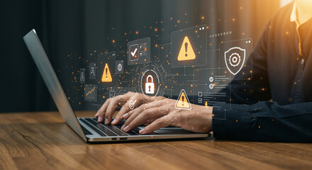 Cybersecurity concept with person typing on laptop and digital icons data protection