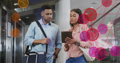 Coworkers tapping tablet screen in lobby, generating animated data network for business analysis - Powered by Adobe